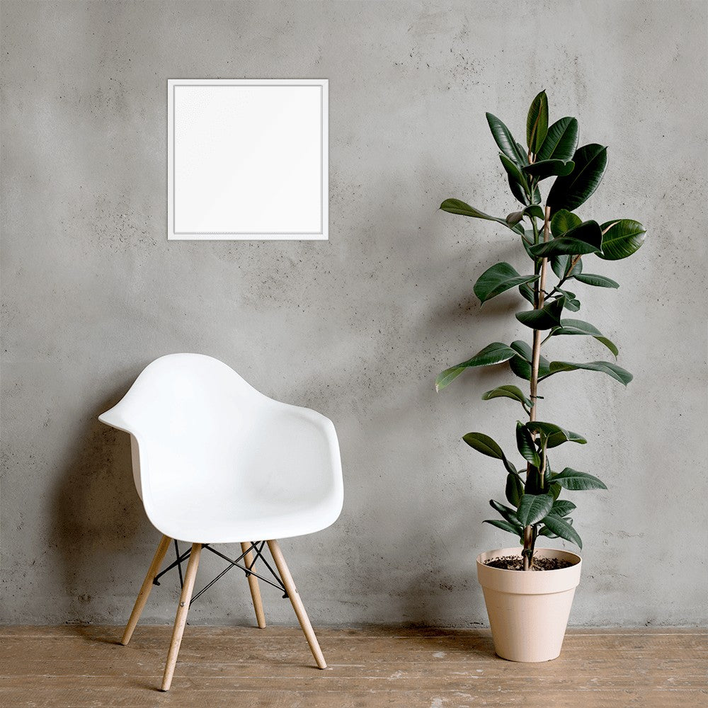 White chair and potted plant against a gray wall with a blank frame.